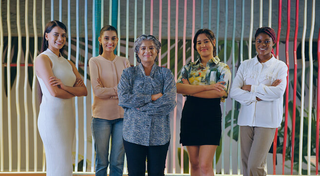 Indian happy proud senior boss ceo women lady group fold hand look camera do casual pose indoor work place. Asian smiling young adult expert girl female staff team cross arms staring cam job office