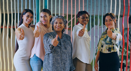 Indian happy active woman lady expert group show thumps up do hand sign look cam make pose at job work place Asian smiling young adult proud girl female staff good team staring camera indoor office