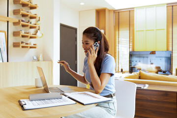 Woman enjoys book and music in modern abode.