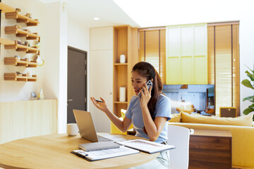 Woman enjoys book and music in modern abode.