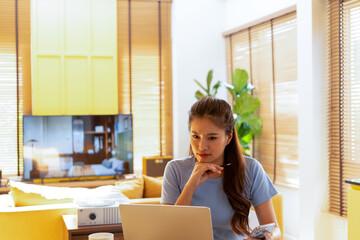 Woman enjoys book and music in modern abode.