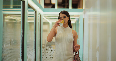 Indian young adult gen z boss ceo expert woman lady walk indoor office hallway space modern female...