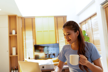 Woman enjoys book and music in modern abode.