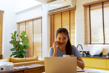 Woman enjoys book and music in modern abode.