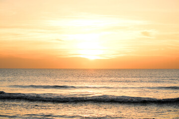 Golden Sunrise Over the Calm Florida Ocean Horizon With Gentle Waves