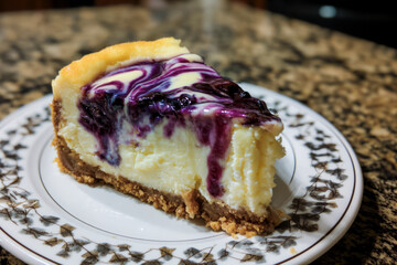 Delicious blueberry cheesecake slice resting on decorative plate