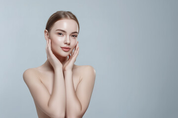 Beautiful woman gently touching face with hands, skincare and beauty concept