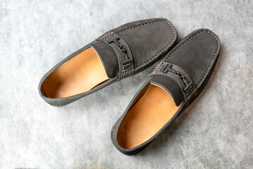 Pair of dark brown modern loafers. Top view