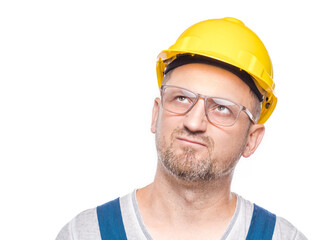 Displeased repairman thinking looking for solution, isolated on white background. Pouting...