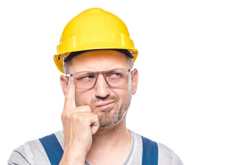 Crafty middle-aged construction worker thinking. Closeup portrait of smart person looking for inspiration, copy space for text, isolated on white background. Thoughtful repairman looking up