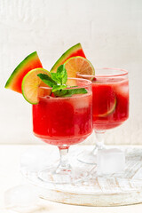 Fruit Summer drink or cocktail in a white background. Fresh watermelon juice, made with fresh...