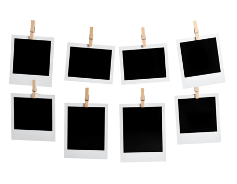 A collection of blank instant photo frames and wooden clothespins hangs ready for cherished memories.
