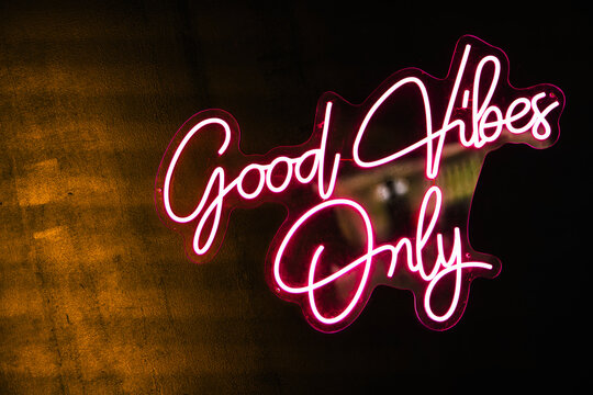 Neon sign radiating positive energy and vibes