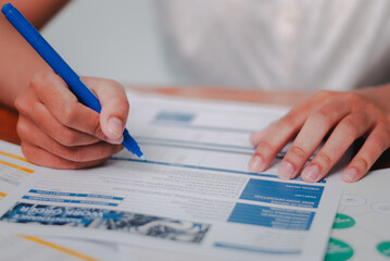 Business insights document preparation office setting writing process professional environment...