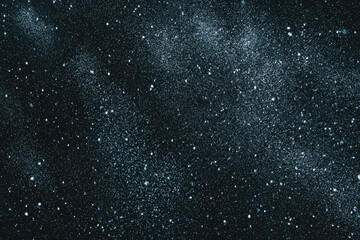 Fototapeta premium Starry night sky with countless white stars scattered across deep black space, creating dreamy cosmic texture and sense of wonder, perfect for backgrounds or astronomy themes