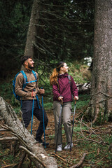 Young Couple Hiking in the Mountains Admiring Nature with Full Gear