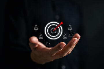 Business goal achievement concept with target and rocket icon mission success, startup growth...
