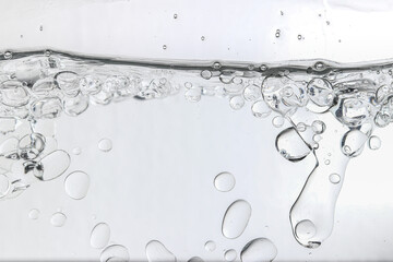 Crystal-clear liquid with rising bubbles, symbolizing purity, hydration, and freshness. Perfect for...