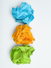 Colorful Crumpled Paper Balls Aligned Vertically