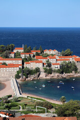 resort village and island in Budva municipality of Sveti Stefan, Montenegro. Close-up of the island architecture and the bay near it