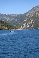 Motorboats sailing on the Bay of Kotor in Montenegro.