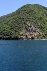 View of the building among the mountains and the sea. Bay of Kotor on the Adriatic Sea. Montenegro