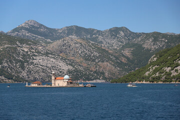 Madonna Reef or Our Lady of the Reef. Island in the Bay of Kotor. Artificial island with a church, Montenegro. Horizontal photo