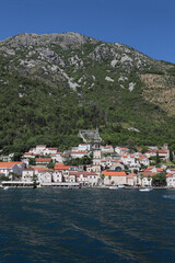 The town of Perast in the Bay of Kotor with mountains in the background.