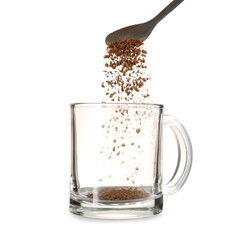 Adding granulated instant coffee from spoon into glass cup isolated on white, closeup