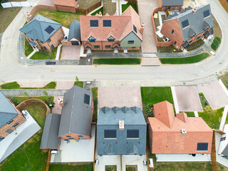 Aerial view of newly completed and ready for sale private and affordable homes seen on a new housing development in Britain. New home owners will have moved in within the next few weeks.
