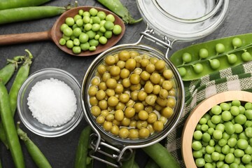 Pickled peas, salt and pods on black table, flat lay
