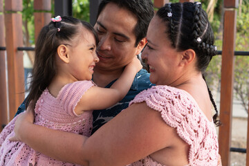 Hispanic family embracing and showing love and affection
