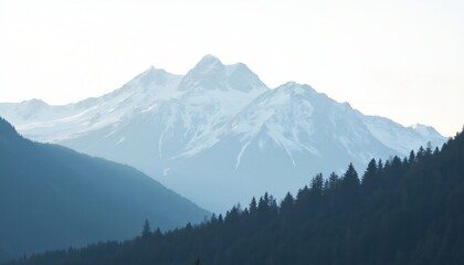 Obraz premium Snow capped mountain range viewed from a forested hillside Distant peaks and valleys under a bright sky