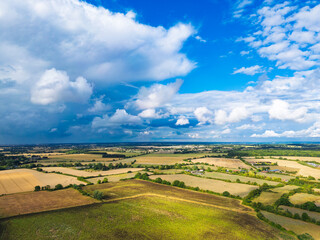 Aerial view of a dramatic pre storm summer sky seen casting shadows over rural farmland in Britain. Seen prior to a heavy storm.