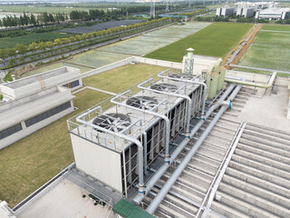 Cooling tower on roof top of building. Industrial air cooling system.
