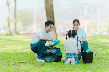 Asian family on summer vacation, parents teaching children to pick up plastic bottles and trash in...