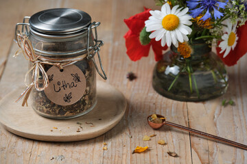 Litha incense blend with herbs and resins on rustic wooden table