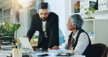Explaining, colleagues and man with laptop, pointing and collaboration with project manager or chat. Teamwork, employee and people with tech for opportunity, planning and info for investment pitch