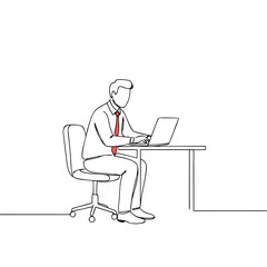 Businessman working on laptop while sitting at desk in office  