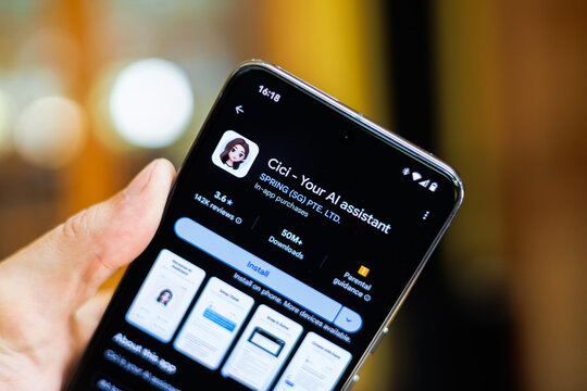 Phone in hand displaying Cici Your AI assistant app on Google Play Store