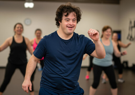 Young man with down syndrome leading energetic dance class indoors, smiling confidently, showcasing joy, confidence, and active lifestyle, diverse group participants in background