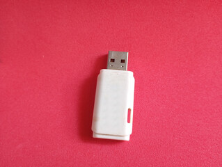 White USB flash drive. Data storage device. Portable digital memory. Computer peripheral.
