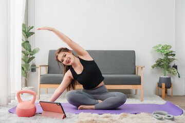 Empowered Wellness: A radiant woman embodies strength and vitality as she joyfully embraces...