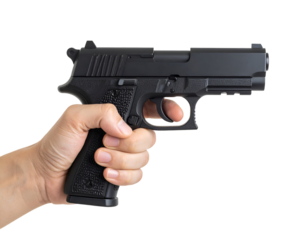 A human hand firmly grips a dark firearm, finger positioned on the trigger with intent.
