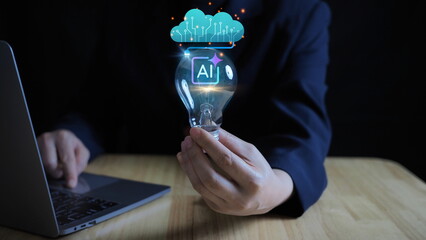 Business solution creativity and modern digital service management concept.hand holding a glowing light bulb represents a concept of artificial intelligence, creative thinking © Bird Photographer TH