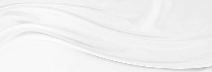 White gray satin texture that is white silver fabric silk panorama background with beautiful soft blur pattern natural.