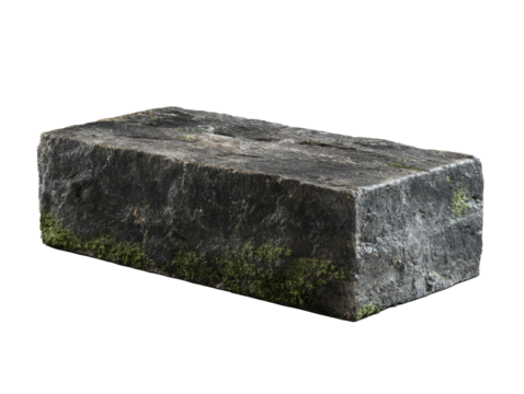 Rough dark gray stone block with green moss growing on its sides isolated on transparent background