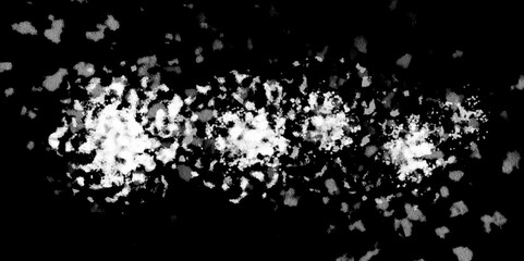 White snowflakes on a black background surface. Macro nature pattern backdrop. Snow overlay background isolated on black. Winter concept. scratches and cracks which can be used as a background.