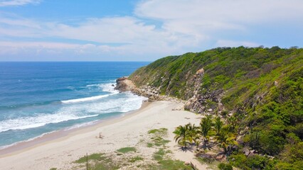 Aerial view of a Mexican beach, at the end of the cliff.
