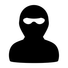Silhouette of person wearing ski mask or balaclava creating anonymity and fear